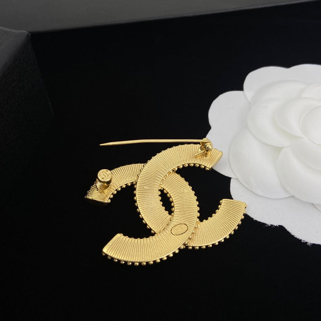 Vintage Logo brass brooch